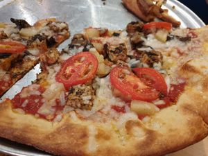 Jerk tofu, tomato, pineapple, mushroom, vegan cheese at Mellow Mushroom - King St in Charleston