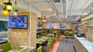 Large Dining Area to accommodate 80 guests with Private dining space powered with Large Projection screen and AV system for private events and business meetings at Woodlands - Wan Chai in Hong Kong Island