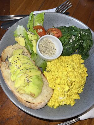 Vegan Scramble - scrambled tofu with spinach & mushrooms (no mushrooms available so we opted for avocado), grilled tomato and fresh salad  at Coffee & Thyme in 