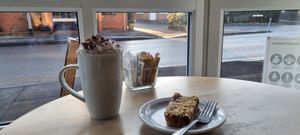 Hot chocolate with whipped cream at No Meating Place in Rugby