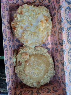 Vanilla custard filled with almonds on top and apple crumble. So good at Brammibal's Donuts - Schanzenviertel in Hamburg