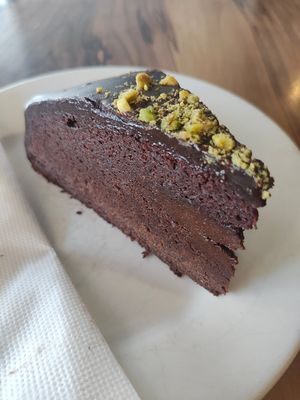 Vegan mudcake with crushed pistachios at Hides Bakery in Benalla