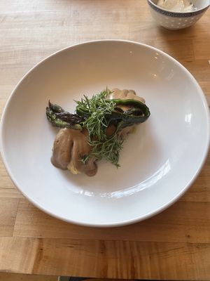 Tamale with sunflower seed mole, topped with asparagus & charred poblano 🫔   at Mandarava in Newburyport