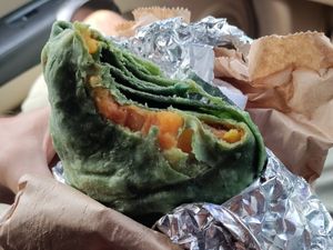 Spirulina roti filled with potatoes and split pea curry at Vegan Vibes in St Georges