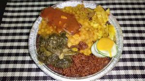 Monday meal: basmati rice, split peas, cabbage & mushroom, greens & cucumber and patty at Vegan Vibes in St Georges