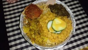Tuesday meal: Spaghetti & meatball with cabbage and mushroom stew, split peas, callaloo and cucumber. at Vegan Vibes in St Georges