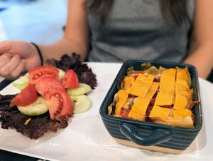 Vegan lasagna with vegan cheese on top at Serenity in Mindo