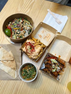 Vietnamese noodle salad, muhammara, chive + leek wontons, togarashi fries  at Salt N Fire in Inverness