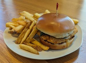 Pesto Chick'n Parm Sandwich with Golden Fries at Veggie Grill by Next Level in Portland