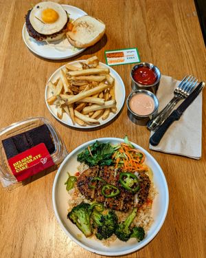 Sunrise Kimchi Burger with Golden Fries; Far East Thai Chick'n; Belgian Chocolate Cake at Veggie Grill by Next Level in Portland