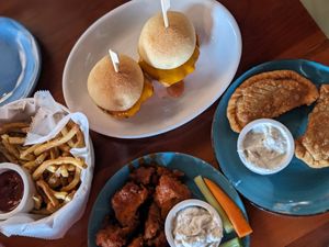Fries, sliders, empanadas & buffalo cauliflower wings at Despacito in Burlington
