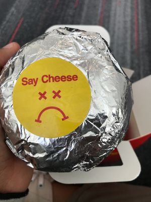 Burger with wrapper at Mr.Charlie's - San Francisco in San Francisco