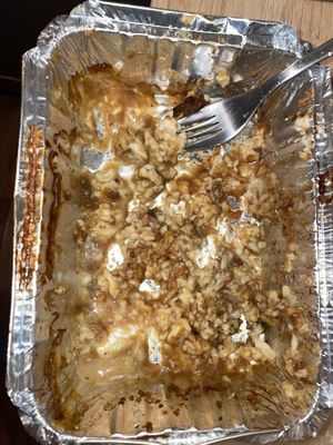 This is how much topping was “too much” on the vegan Poutine!  I forgot to take a before photo.  Uses Vitalite cheese; gluten free deep fryer.   at Nico's Pizzeria in Revelstoke