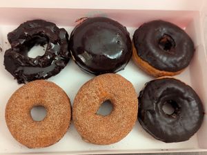 Cinnamon and sugar and chocolate glazed sharing a box with my partner's two non vegan donuts at Stan's Donuts & Coffee in Oakbrook Terrace