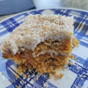 Maybe the best carrot cake with lemon cream. Sorry for the almost eaten piece. at Cafe Erde in Graz