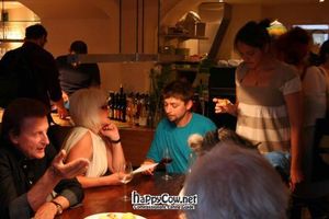 big table and organic-juices, -wine and -beer at the bar at Cafe Erde in Graz