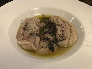 Beet filled dumpling in vegan butter sauce. at Cafe Erde in Graz