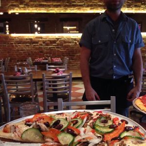 Waiter photobomb! at District of Pi Pizzeria in Washington
