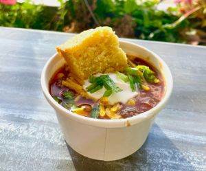 Lentil, kidney beans with corn. Served with a. cornbread muffin
 at Blue Tree Cafe Vegan Soul Food - Cloud Kitchen in Fort Lauderdale