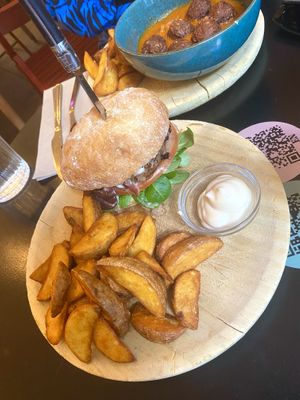 Vegan Queer burger, Huera meatballs in background  at La Oveja Negra in Madrid