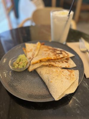 Quesadillas filled with seitan and served with an avocado dip  at La Oveja Negra in Madrid