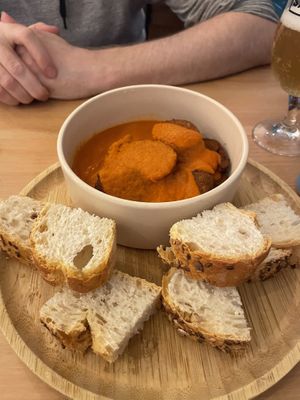 Chorizo in cider saucee  at La Oveja Negra in Madrid