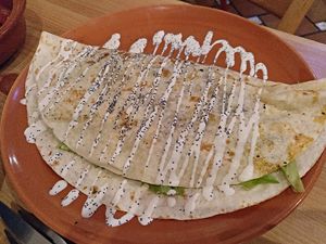 Piadina de setas: wheat tortilla stuffed with mushrooms, leeks, courgette and sweet potato at La Oveja Negra in Madrid