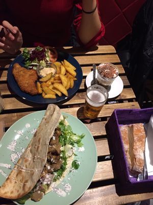Soy schnitzel and tortilla with champions and vegetables. Bread as an appetizer. Also very nice coffee with whipped cream and chocolate. at La Oveja Negra in Madrid