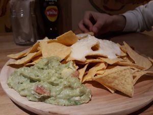 Nachos with vegan cheese, guacamole and chilli. at La Oveja Negra in Madrid