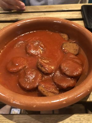Chorizos en sidra, muy ricos  at La Oveja Negra in Madrid