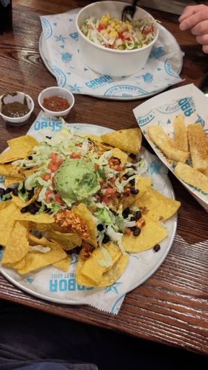 Nachos with vegan chorizos + yucca fries at Sabor Latin Street Grill in Durham