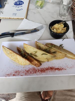 Baked Potatoes w olive oil & Almond flour cheese at OPA Greek Bistro in Puerto Vallarta
