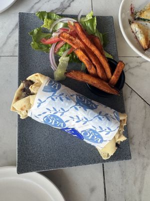Vegan Gyro with mushrooms, sweet potato fries and salad very very  at OPA Greek Bistro in Puerto Vallarta