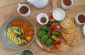 Goulash; Mongol combo (buuz, khuushuur, shorlog/barbecue, green salad) at Foody Vegan Experience Center  in Ulaanbaatar