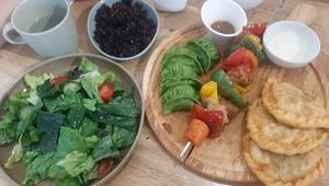 Mongol combo (buuz, khuushuur, shorlog/barbecue, green salad) at Foody Vegan Experience Center  in Ulaanbaatar