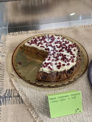 Vegan carrot cake with raw cashew coconut creme and pomegranate seeds  at Manjari in Burgas