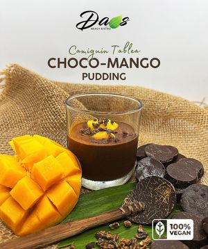 Native cacao chocolate with almond & coconut milk topped with sugar-coated cacao nibs & fresh mangoes. at Daos Beach Bistro - Haruhay Eco Beach Tavern in Camiguin