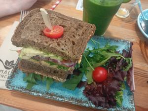 Green smoothie and vegan sandwich (perfectly well seasoned imo) at La Mala Brunch - Setas in Sevilla