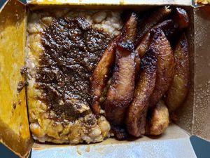 Jollof rice with plantains and beans meal  at Afro Delight in Limerick