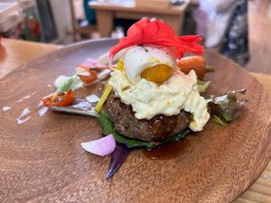 A vegan hamburg steak topped with a vegan egg and vegan tartar sauce.  at Ryuness - リューネス（ゆかるひ店） in Okinawa