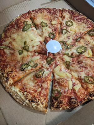 Pineapple and jalapeno pizza with vegan cheese at Glass Nickel Pizza Co in Appleton