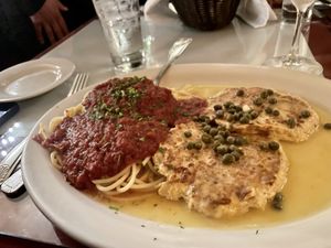 Vegan chicken piccata with spaghetti marinara  at Chase Restaurant and Lounge - temporarily closed in Santa Barbara