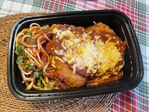 breaded vegan chicken parmigana topped with marinara sauce and vegan cheese, served with spaghetti marinara  at Chase Restaurant and Lounge - temporarily closed in Santa Barbara