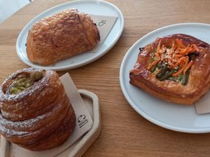 pistachio cruffin (100czk≈4€), pain au chocolat (60czk≈2,42€), savoury danish (75czk≈3,03€) at Krafin in Prague