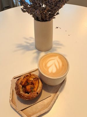 Coffee and savoury pastry with tofu and pumpkin at Krafin in Prague