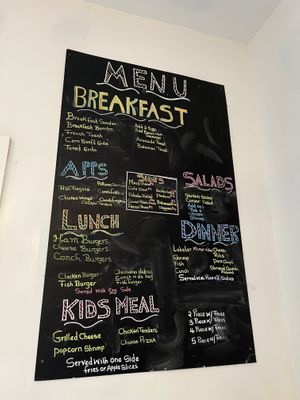 Food menu (try the Bahamian rice, it’s the best on the island!)  at Sweet Tooth Coffee Shop in Great Abaco