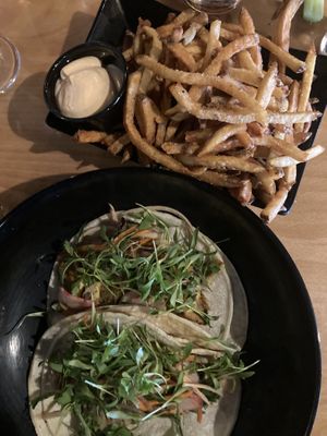 Fried avocado tacos and the most delicious fries and vegan chipotle aioli!   at The Tiny Pony Tavern in Yucca Valley
