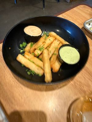 Yucca fries with delicious vegan sauces! at The Tiny Pony Tavern in Yucca Valley