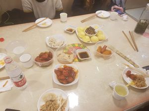 Left to right: vegan ham with sweet sauce, dumpling, buns with side filling, and "chicken" wings at Water Lotus 清水荷花食坊 - 武侯祠 in Chengdu