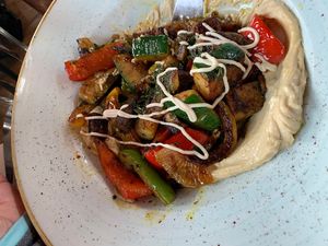 Grilled veggies on hummus, served with warm pita bread  at Orient Occident in Vienna